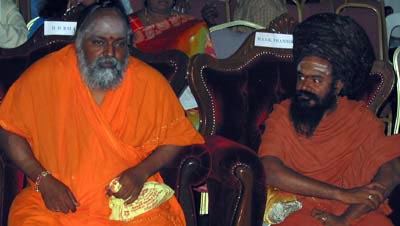 Bala Yogi Swamiji (left) and Thambiran Swamigal (right)
