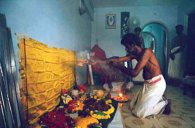 The Itumban puja performed at a devotee's home, marking the end of the festival