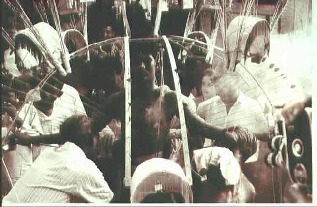 An archival photo of a devotee carrying a kavadi taken in the 1940s